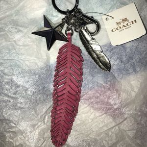 COACH Fuchsia leather and metal feather keychain